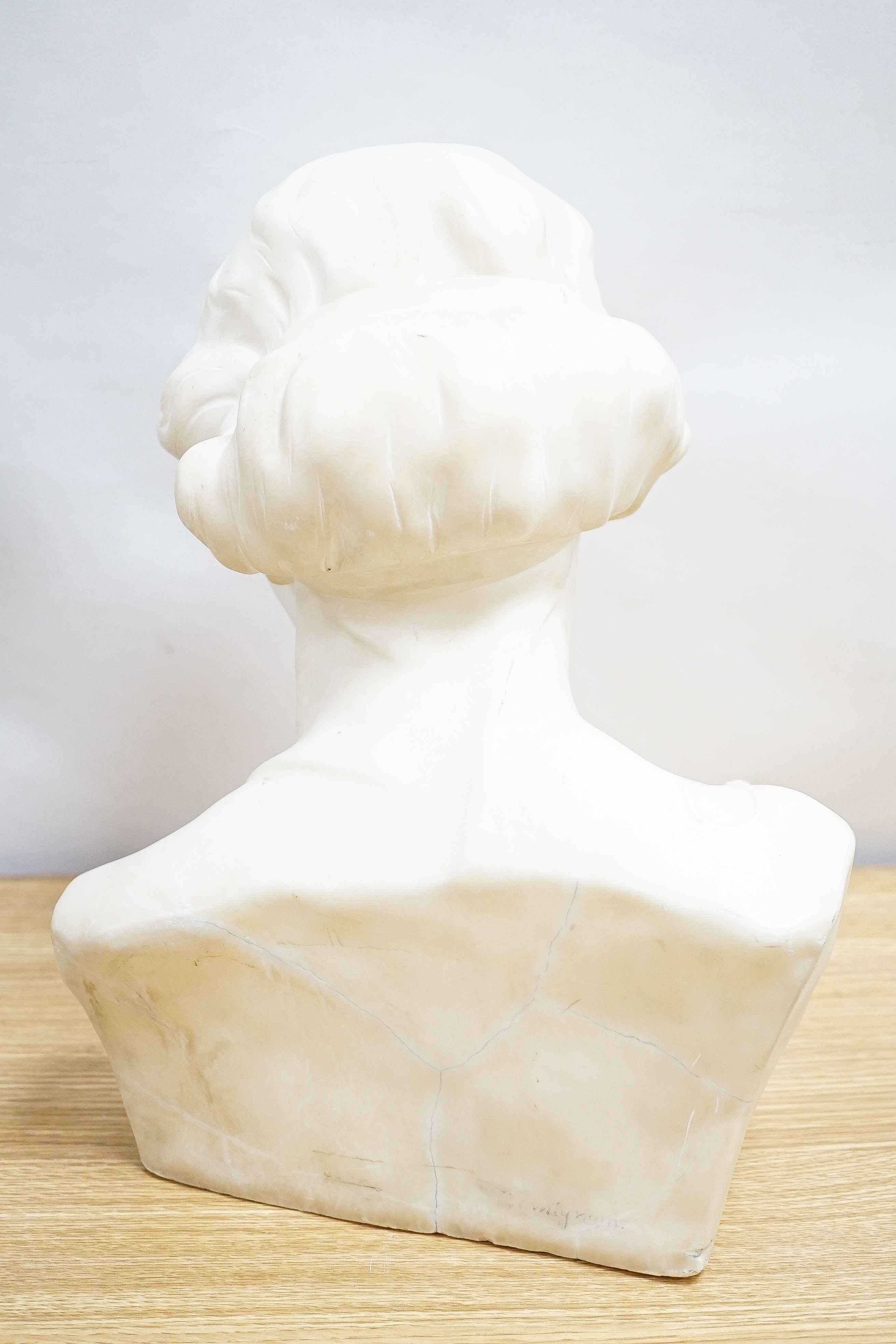 Valmore Gemignani, Italian 1879-1958, a carved alabaster bust of a lady, signed, 38cm